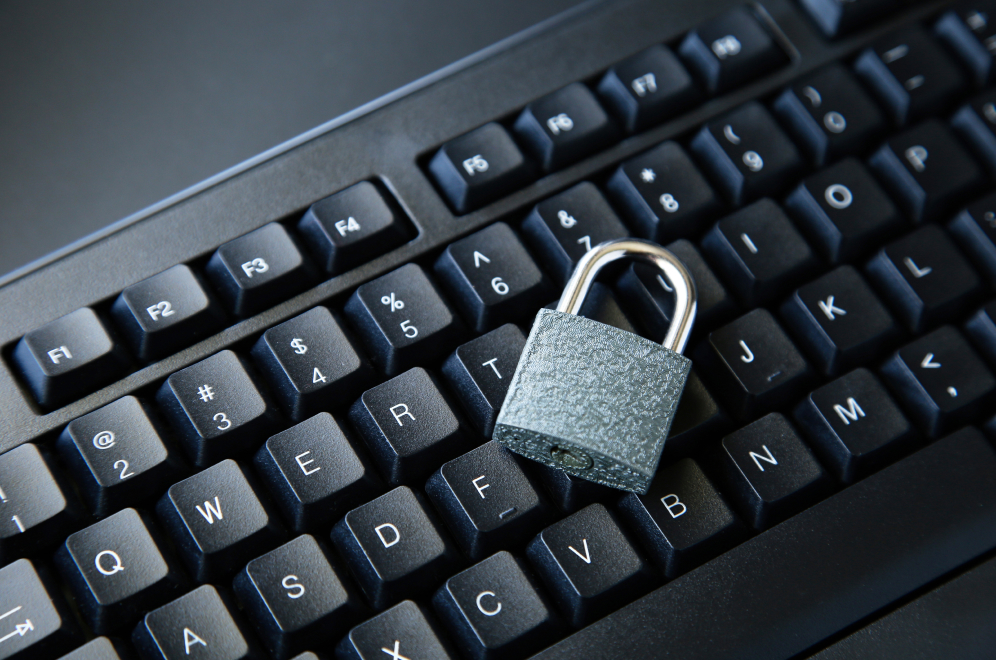 A padlock resting on a computer keyboard